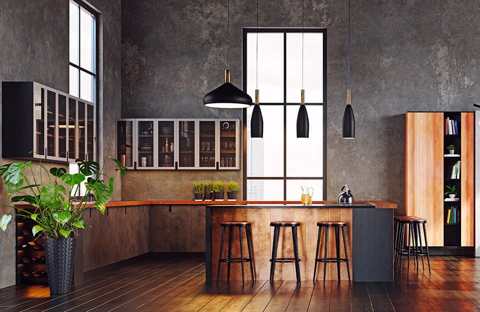 Cucina moderna in ambiente industriale, con pareti in cemento grezzo, grandi finestre e parquet in teak