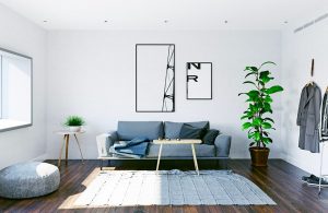 Un salotto moderno, minimale e luminoso sui toni del bianco e del grigio, con parquet in olmo