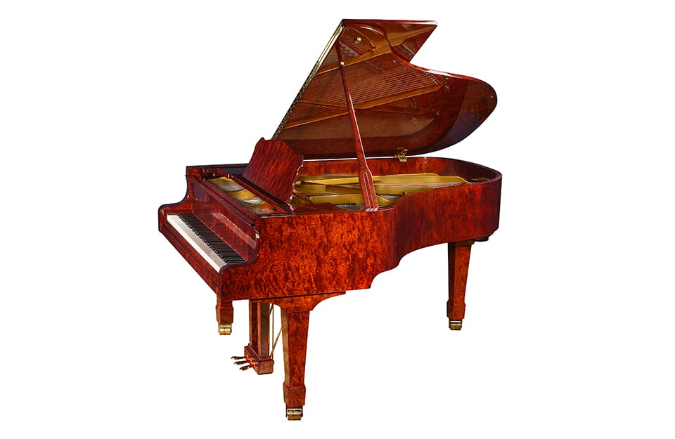 Un pianoforte a coda in legno di bubinga