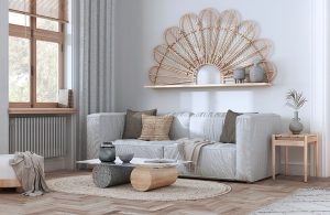 Salotto arredato in stile scandinavo-rustico, con sofa grigio e mobili in legno chiaro su parquet sbiancato e tappeto