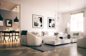 Un salotto moderno con mobili di design sui toni del bianco e del nero e pavimento in parquet